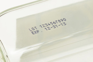 multi-line lot and expiration date on bottom of glass surface