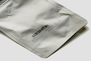 graphic logo and manufacturing code on plastic surface of foil packaging